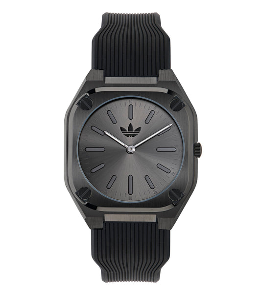 Adidas watch in vibrant blue displayed at a right angle; sleek design featuring minimalistic face, luminous hands, and sporty band.