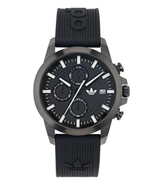 Adidas silver watch with a round face and minimalist design, showcased at a 45-degree angle, highlighting its sleek and modern aesthetics.