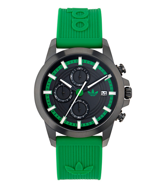  Adidas watch with a two-tone blue and white design, stylishly angled, showcasing its sleek bezel and digital display.
