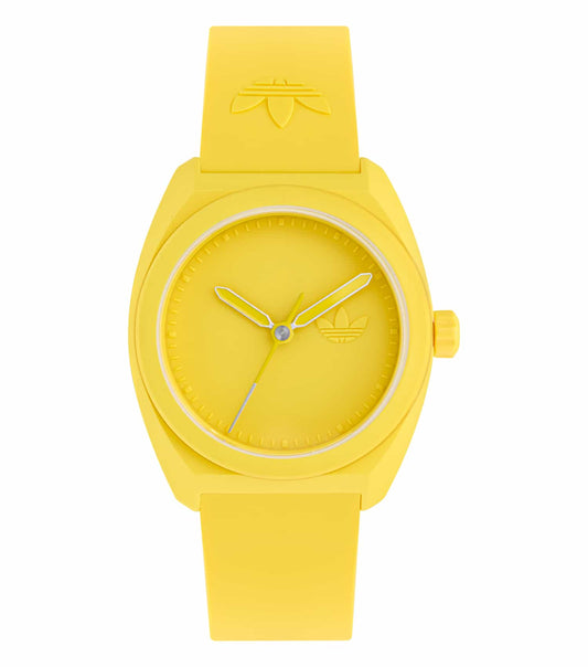 Adidas yellow watch with round face, angled at 42 degrees, showcasing its minimalist design and vibrant wristband.