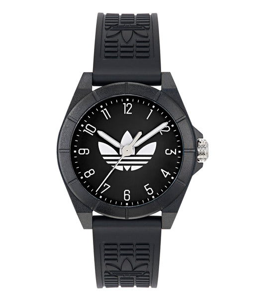 Adidas analog watch with a black face and silver casing, featuring sleek hands and markers, angled slightly for a stylish look.