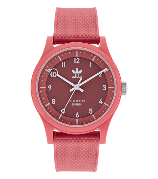Adidas watch in neutral hue, side view showcasing minimalist design, black silicone strap, and bold watch face with white accents.