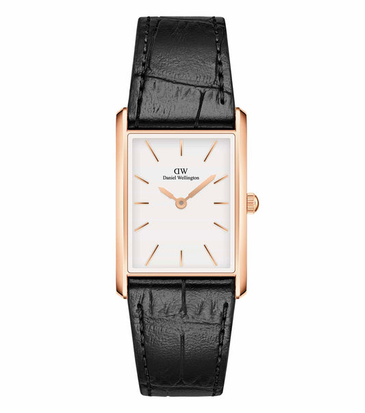 Daniel Wellington quartz watch in a clean white background, displaying elegant round design and classic tan leather strap, side angle.