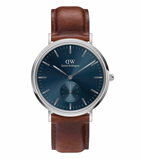 Daniel Wellington watch in multi-color, angled at a close-up view, showcasing elegant design and timeless style in wristwatches.