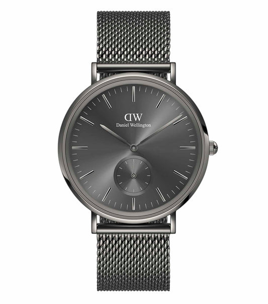Daniel Wellington classy watch in silver, side angle view shows minimalist design and single black strap against a white background.