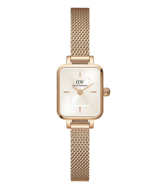 Elegant Daniel Wellington mini quartz watch in brown and silver, angled to showcase its minimalist face and stylish strap.