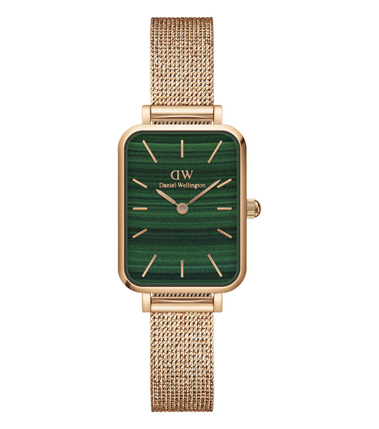Elegant Daniel Wellington rose gold watch with minimalist design, round face, and side angle view showcasing timeless sophistication.