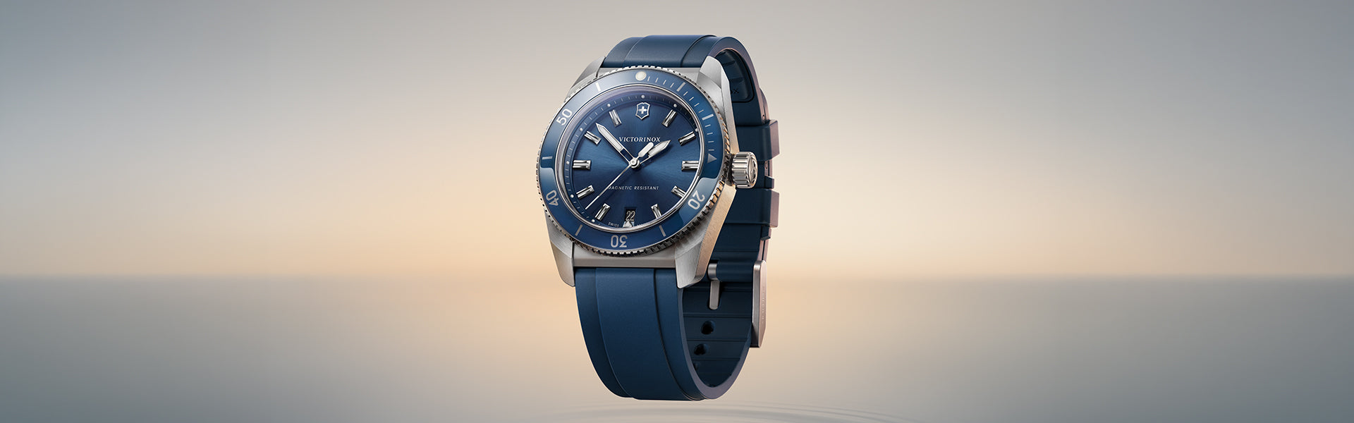 Victorinox watch with a blue dial, rotating bezel and matching blue rubber strap, designed for everyday style and active wear. 