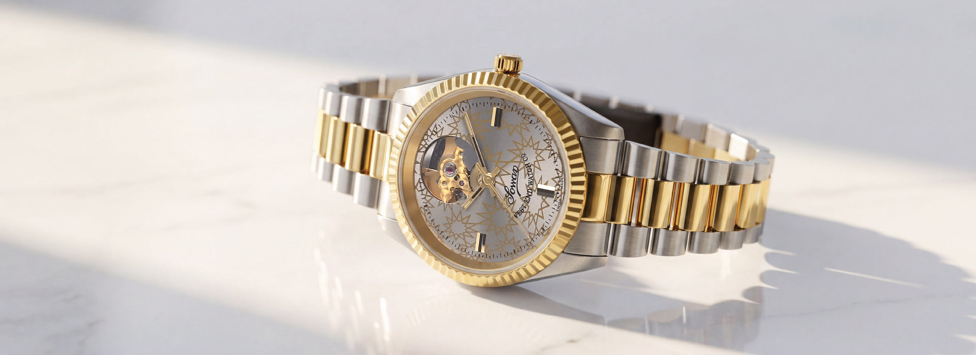 West End automatic watch with open-heart dial, two-tone bracelet and fluted bezel