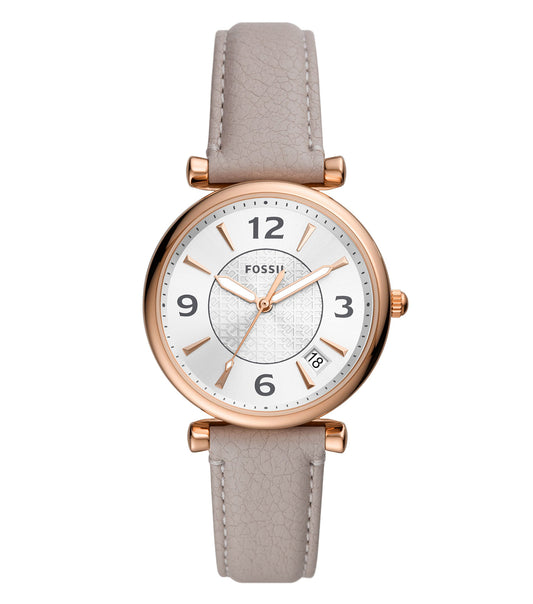 Fossil Quartz watch with a sleek gold-tone finish captured at an elegant side angle against a soft, neutral background.