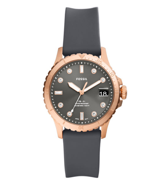 Fossil watch with a minimalist pink gold-tone finish, photographed from an angled top view, showcasing its elegant round dial and stainless steel bracelet.