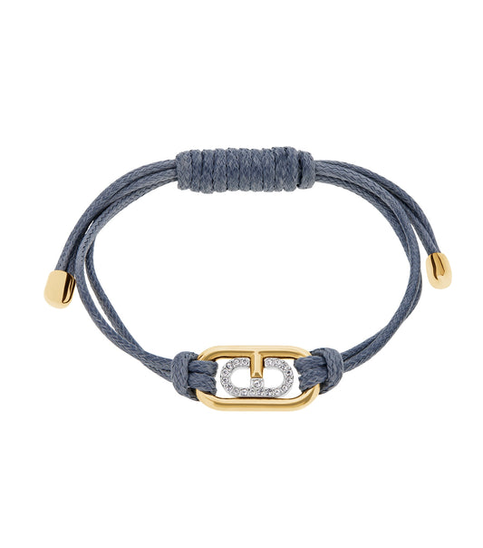 Furla gold bracelet with unique design, elegantly captured from side angle, showcasing its luxurious craftsmanship and gleaming hue.