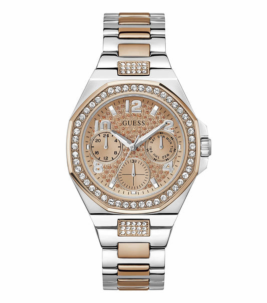 Guess watch in rose gold color, angled view displays the elegant round dial with sparkling accents on the bracelet, showcasing glamour.