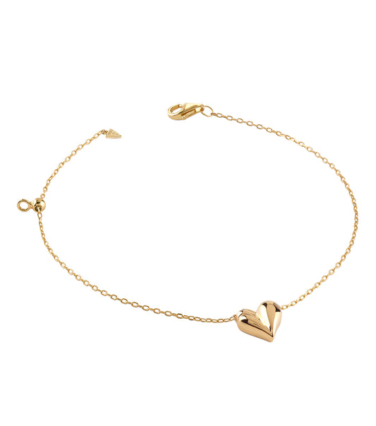 Elegant Guess Jewellery gold bracelet, side angle view, showcasing intricate link details and shimmering golden finish.
