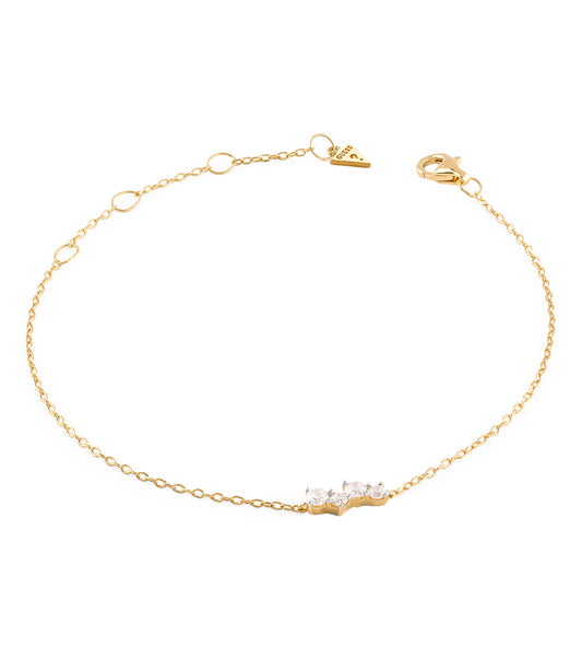 Elegant Guess Jewellery gold-colored ID bracelet showcasing a polished finish from a side angle against a white backdrop.