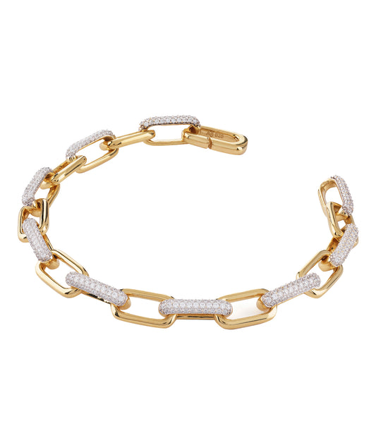 Elegant Guess Jewellery gold bracelet with intricate detailing, photographed from a side angle showcasing its luxurious shine.