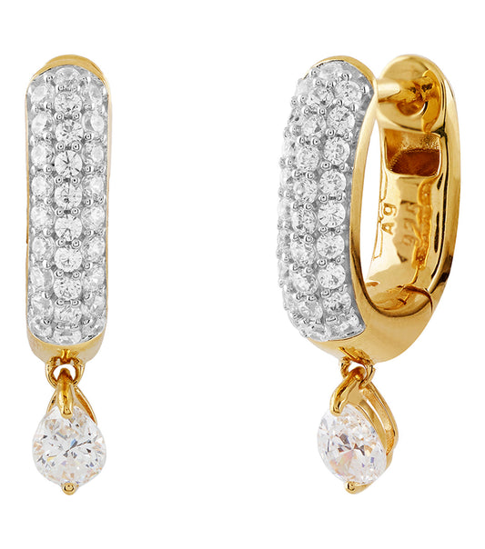 Gold-tone hoop earrings by Guess Jewellery showcasing sleek design and subtle logo engraved, angled front-right view against a minimalist background.