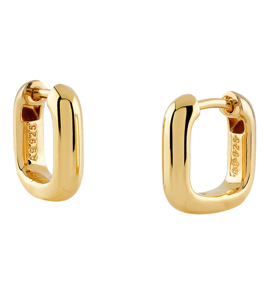 Guess Jewellery gold earrings with GUESS logo and crystal embellishments on display, top view angle, exquisite craftsmanship.