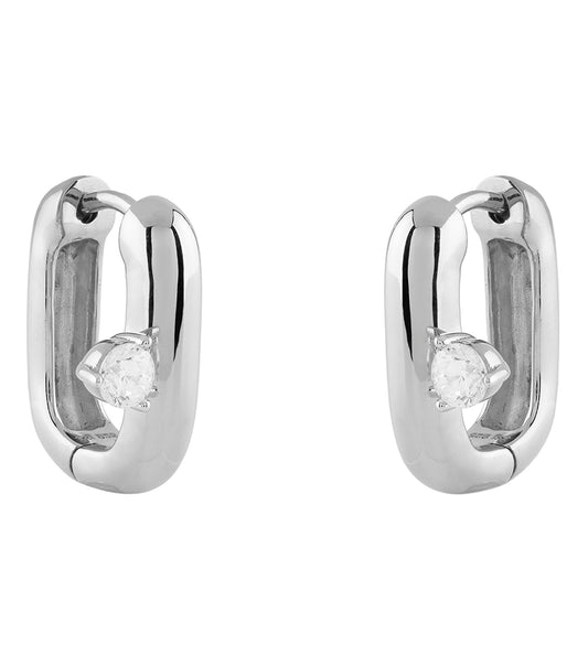 Elegant Guess Jewellery silver earrings, close-up angled view, shimmering curves and intricate design showcasing refined craftsmanship.