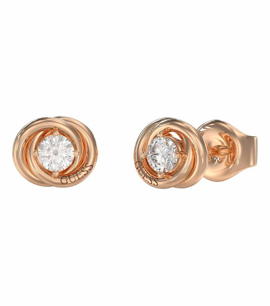 Side angle of elegant gold earrings by Guess Jewellery, showcasing intricate design details and shimmering allure.