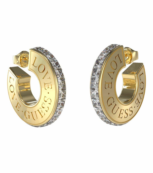 Gold-colored Guess Jewellery earrings captured in a well-lit, angled view, showcasing the intricate details and luxurious flair.