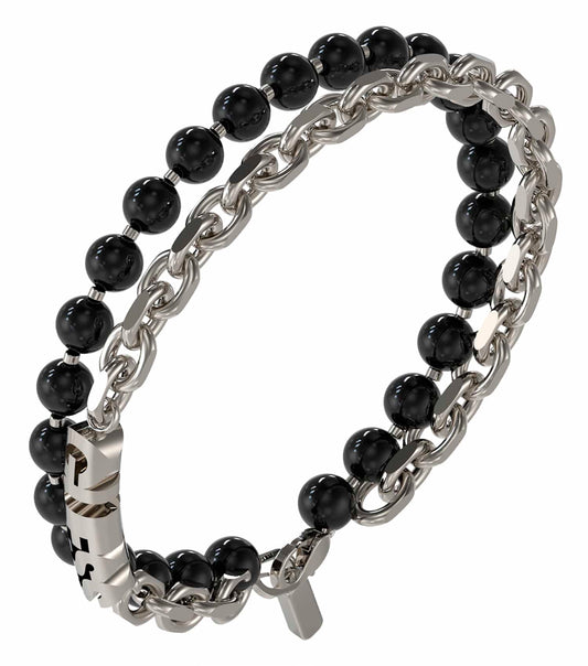 Silver Guess Jewellery bracelet elegantly showcased from a side angle, capturing its sleek design and reflective finish.