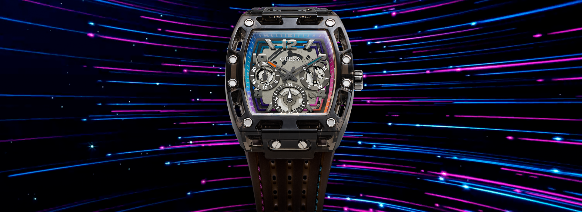 GUESS men's watch with a skeletonized dial and black perforated strap, showcasing a bold and unique watch design.