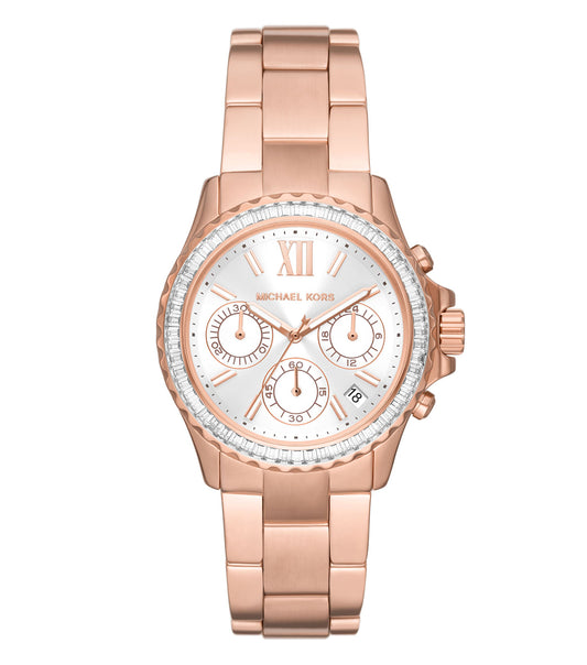 Michael Kors watch in a shimmering gold tone, showcasing the intricate dial design from a tilted angle, embodies luxury.