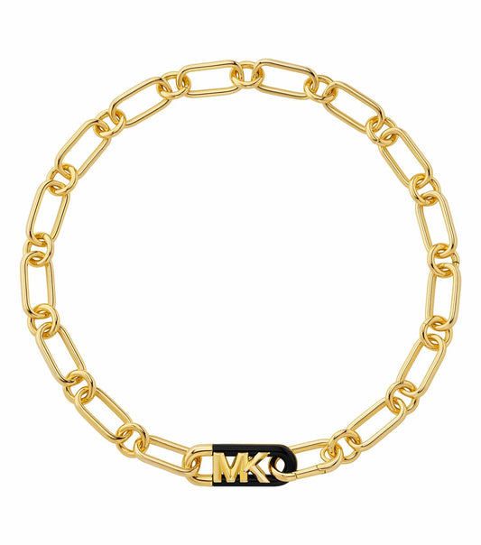 Gold Michael Kors necklace displaying a sophisticated chain design, artistically captured from a side angle, encapsulating luxury fashion.
