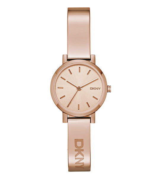DKNY quartz-colored watch displayed at an angled top-down view, showcasing the elegant round dial and stylish metal bracelet.