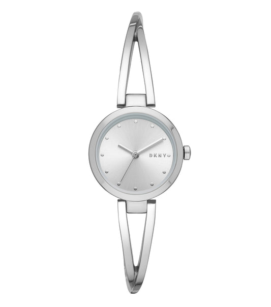 DKNY quartz watch in soft beige, angled frontal view, showcases sleek design with minimalist dial and stainless steel mesh band.