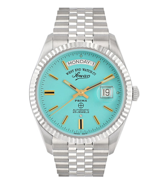 Silver West End watch with elegant round face, luminous hands, and date feature; side angle showcasing classic design and craftsmanship.
